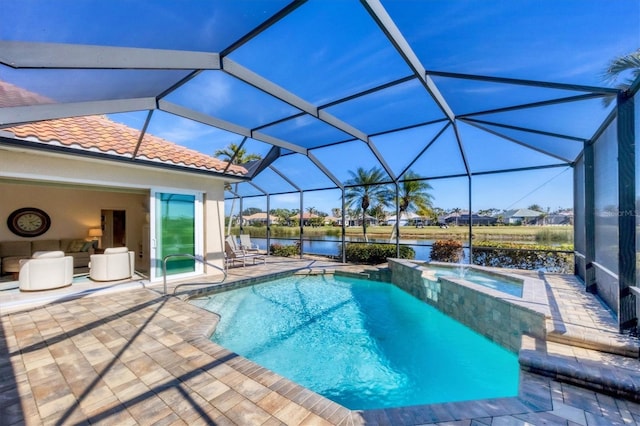 view of swimming pool featuring an in ground hot tub, a water view, a patio area, and a lanai