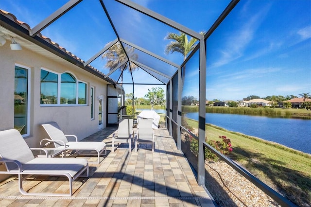 sunroom / solarium with a water view