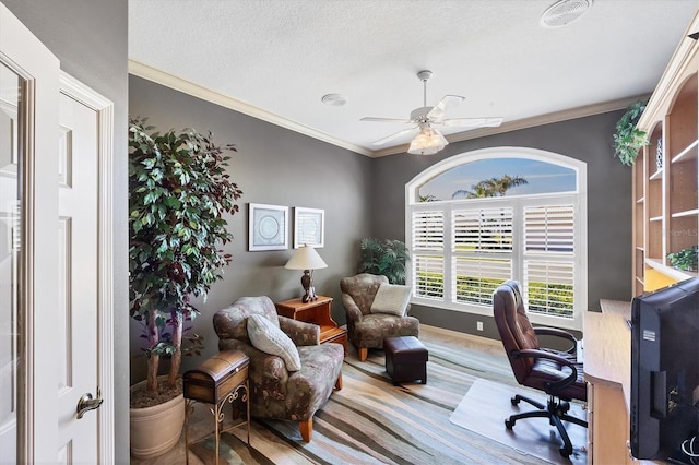 home office with crown molding, a textured ceiling, and ceiling fan