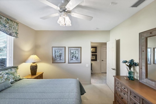 bedroom with light colored carpet and ceiling fan