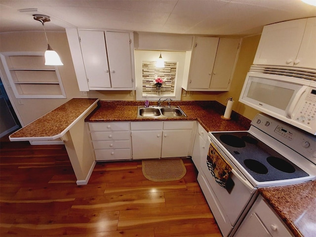 kitchen featuring decorative light fixtures, white cabinetry, sink, dark wood-type flooring, and white appliances