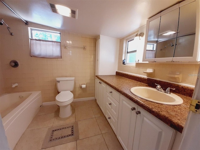 full bathroom featuring shower / bath combination, tile walls, vanity, tile patterned floors, and toilet