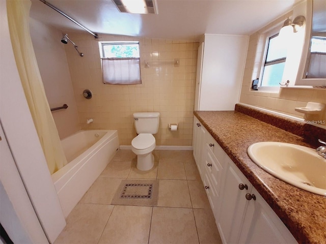 full bathroom featuring toilet, tile walls, vanity, shower / bath combo, and tile patterned flooring