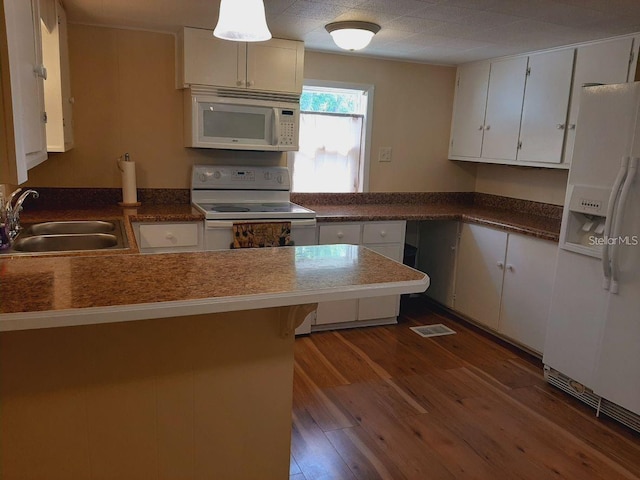 kitchen featuring white cabinetry, sink, and white appliances