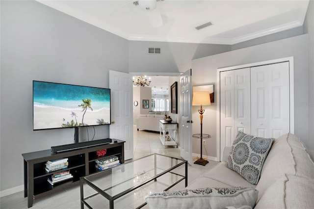 living area with ornamental molding, visible vents, baseboards, and ceiling fan with notable chandelier