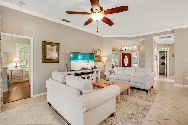 living room featuring visible vents, ornamental molding, and light tile patterned flooring