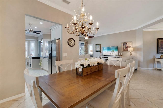 dining area with light tile patterned floors, ceiling fan with notable chandelier, visible vents, baseboards, and ornamental molding