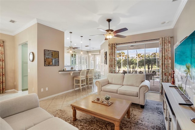 living room with visible vents, crown molding, and light tile patterned flooring