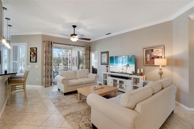 living area featuring ceiling fan, light tile patterned flooring, visible vents, baseboards, and ornamental molding