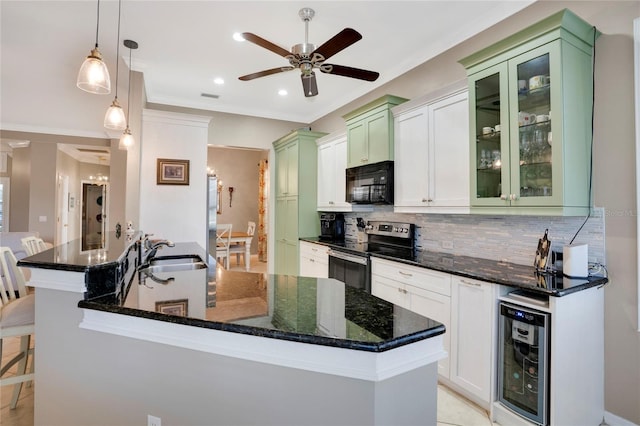 kitchen featuring black microwave, decorative light fixtures, beverage cooler, stainless steel range with electric stovetop, and glass insert cabinets