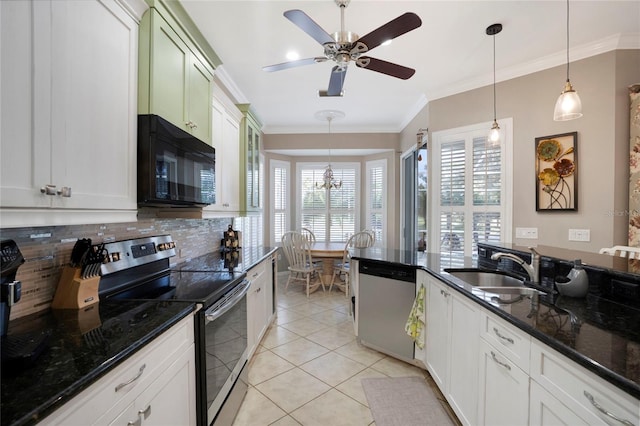 kitchen featuring stainless steel appliances, pendant lighting, crown molding, and a sink