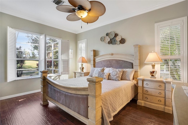 bedroom with ornamental molding, multiple windows, and dark wood finished floors