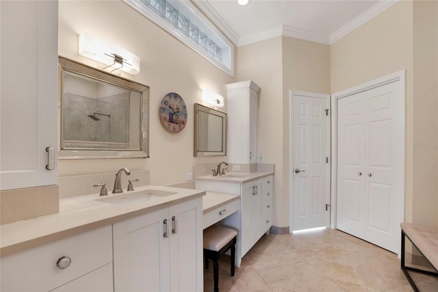 bathroom with a closet, two vanities, a sink, and crown molding