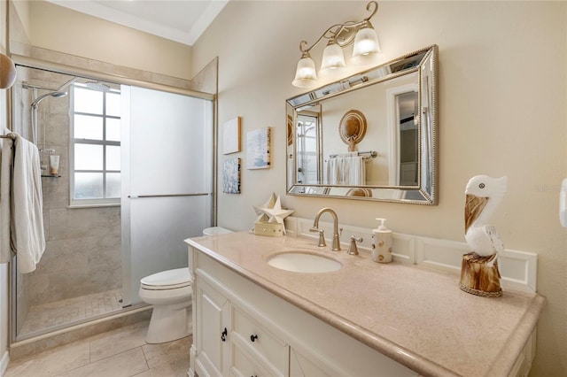 full bathroom featuring toilet, a stall shower, tile patterned flooring, and vanity