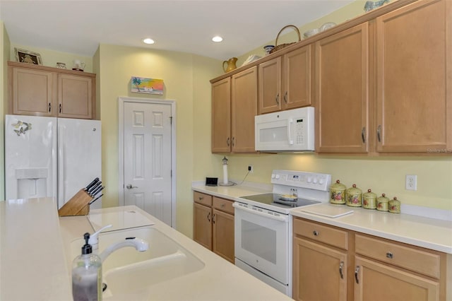 kitchen with sink and white appliances