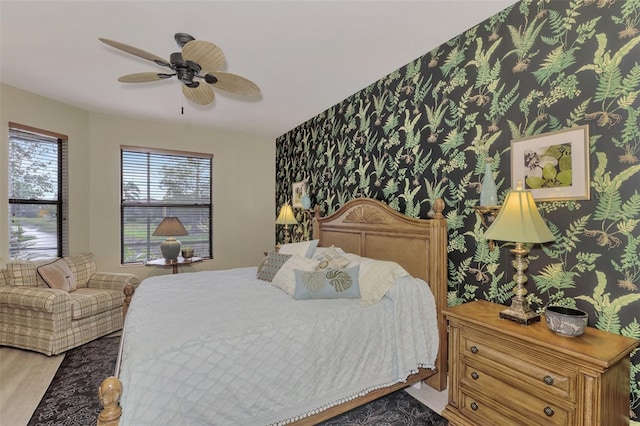 bedroom with light wood-type flooring and ceiling fan