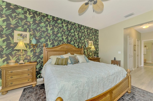 bedroom featuring ceiling fan and light wood-type flooring