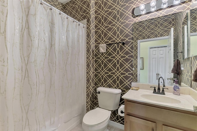 full bathroom featuring vanity, shower / bathtub combination with curtain, and toilet