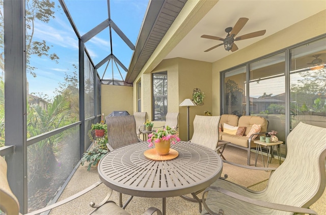 sunroom / solarium featuring ceiling fan