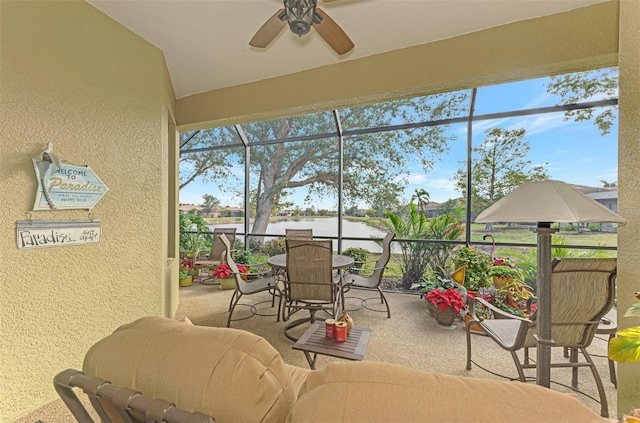 sunroom featuring a wealth of natural light and ceiling fan