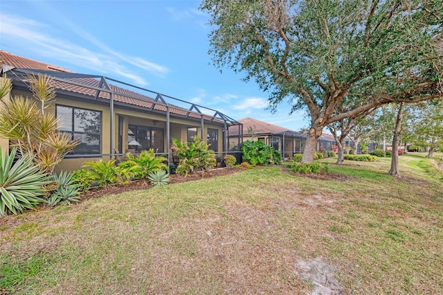 view of yard with a lanai