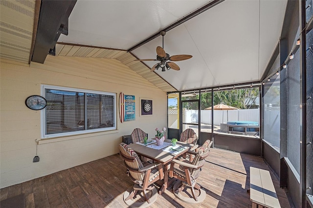 sunroom with ceiling fan and lofted ceiling