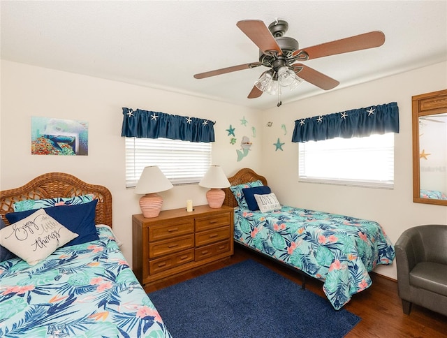 bedroom featuring dark wood-type flooring and ceiling fan