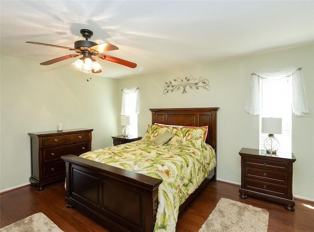 bedroom featuring dark hardwood / wood-style floors and ceiling fan