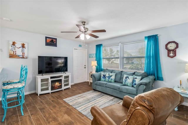 living room featuring dark hardwood / wood-style flooring and ceiling fan