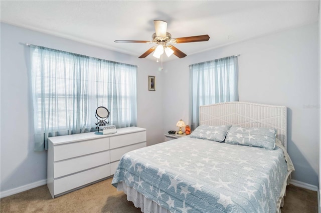 carpeted bedroom featuring ceiling fan