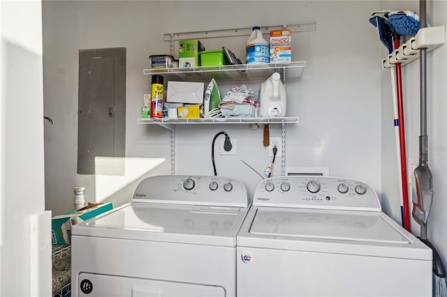 washroom featuring washing machine and clothes dryer and electric panel