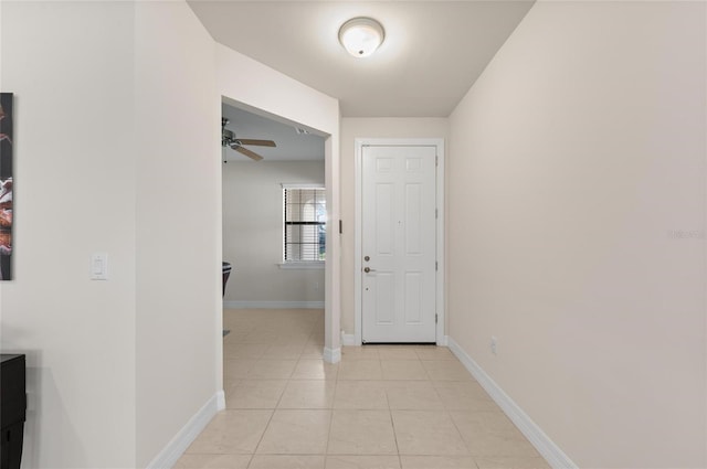 hallway featuring light tile patterned floors