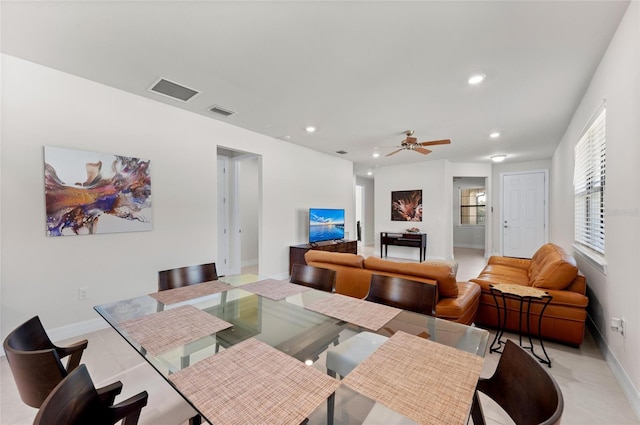 dining room with ceiling fan and light tile patterned floors