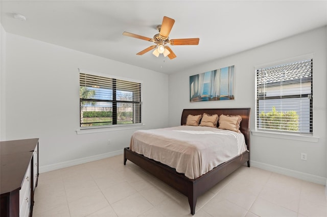 tiled bedroom with ceiling fan