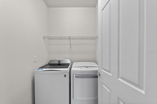 washroom featuring separate washer and dryer