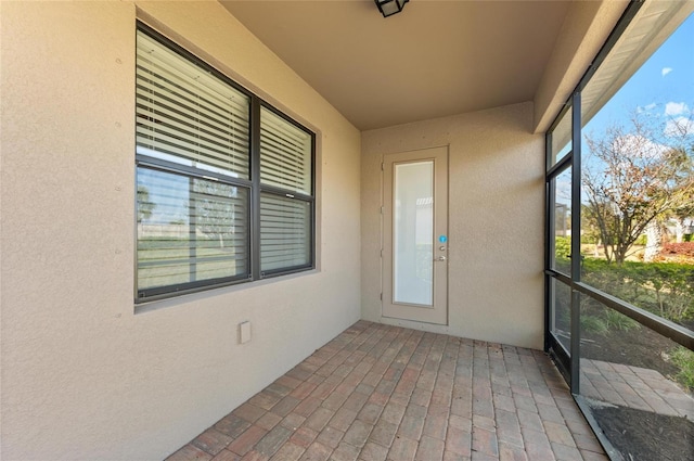 unfurnished sunroom with a healthy amount of sunlight