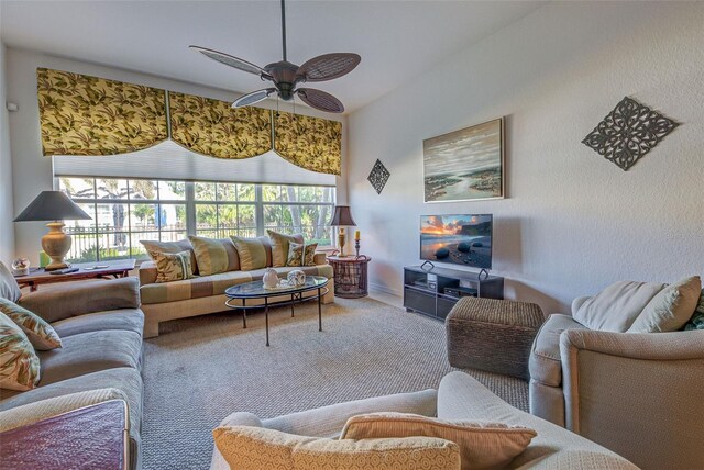 living room with carpet floors and ceiling fan