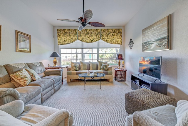 living room featuring carpet and ceiling fan