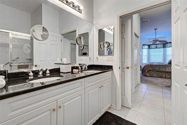 bathroom featuring an enclosed shower, vanity, tile patterned floors, and ceiling fan