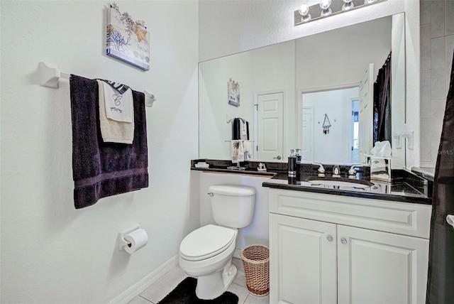 bathroom with vanity, toilet, and tile patterned flooring