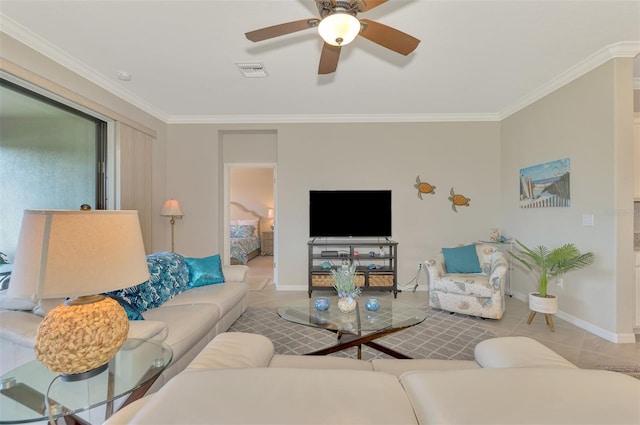 living room featuring ornamental molding, tile patterned floors, and ceiling fan