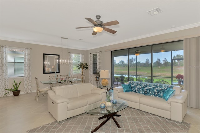 living room with crown molding, a healthy amount of sunlight, and ceiling fan with notable chandelier