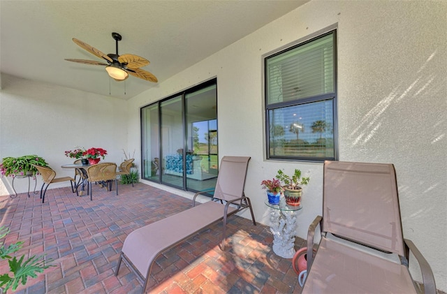 view of patio featuring ceiling fan