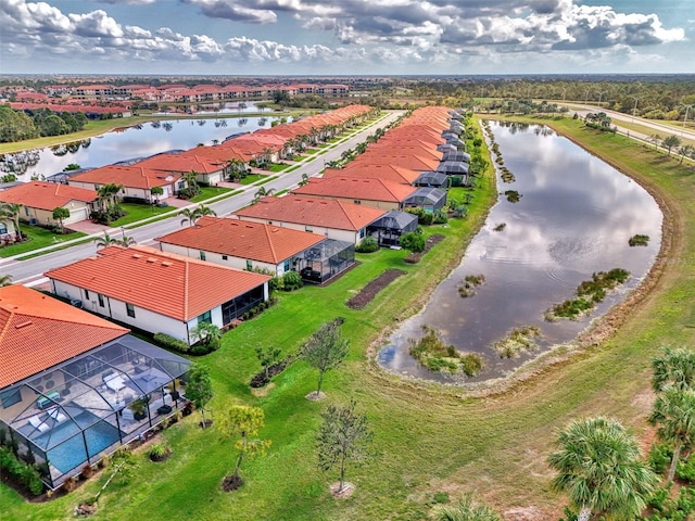 bird's eye view with a water view