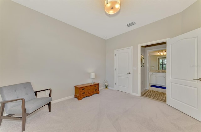 living area featuring light colored carpet