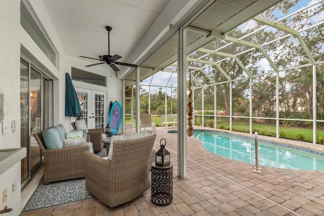 pool featuring a lanai, an outdoor hangout area, a ceiling fan, french doors, and a patio area