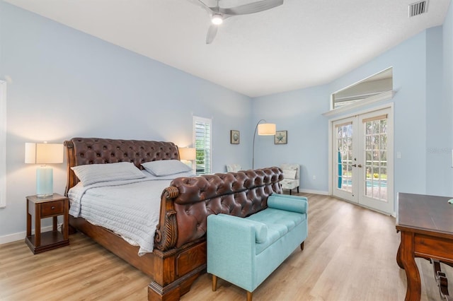 bedroom with access to outside, french doors, visible vents, and light wood-style flooring