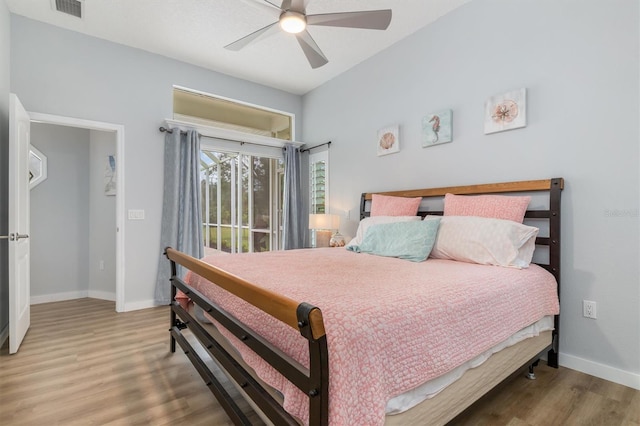 bedroom with ceiling fan, baseboards, and wood finished floors