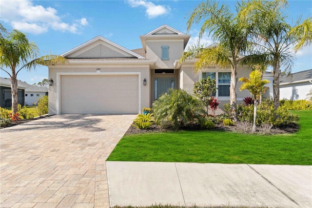 view of front facade featuring a garage and a front lawn