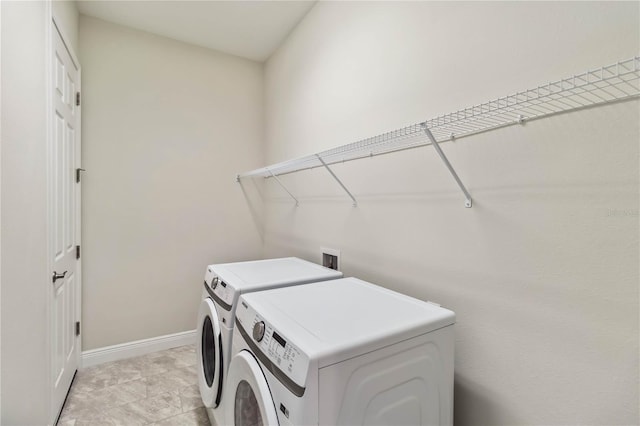 clothes washing area with washer and dryer